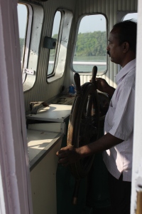 The helmsman steering the ship Chitrarekha